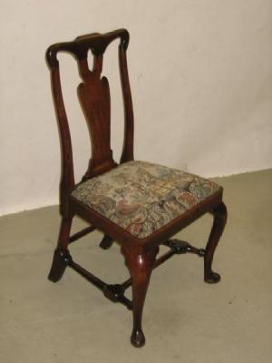 Appraisal: A WALNUT SINGLE CHAIR the waved top rail on solid