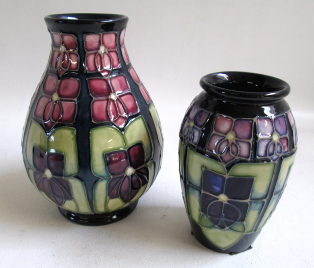 Appraisal: TWO MOORCROFT POTTERY VASES hand painted under glaze in the