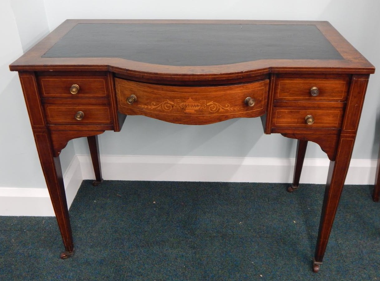 Appraisal: An Edwardian rosewood and marquetry writing table the bow fronted