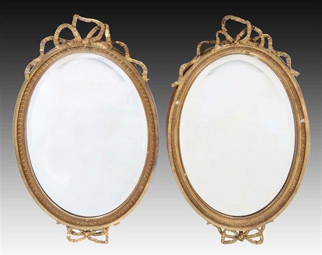 Appraisal: A PAIR OF TH CENTURY GILT FRAME OVAL BEVELLED WALL