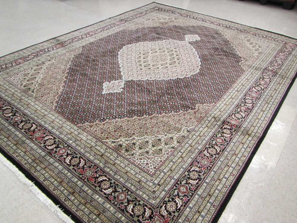 Appraisal: HAND KNOTTED ORIENTAL CARPET Persian Bijar design central medallion and