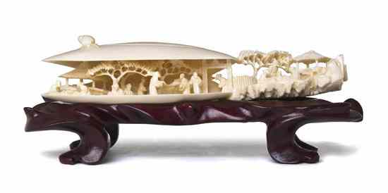 Appraisal: An Ivory Model of a Clam's Dream the shell containing