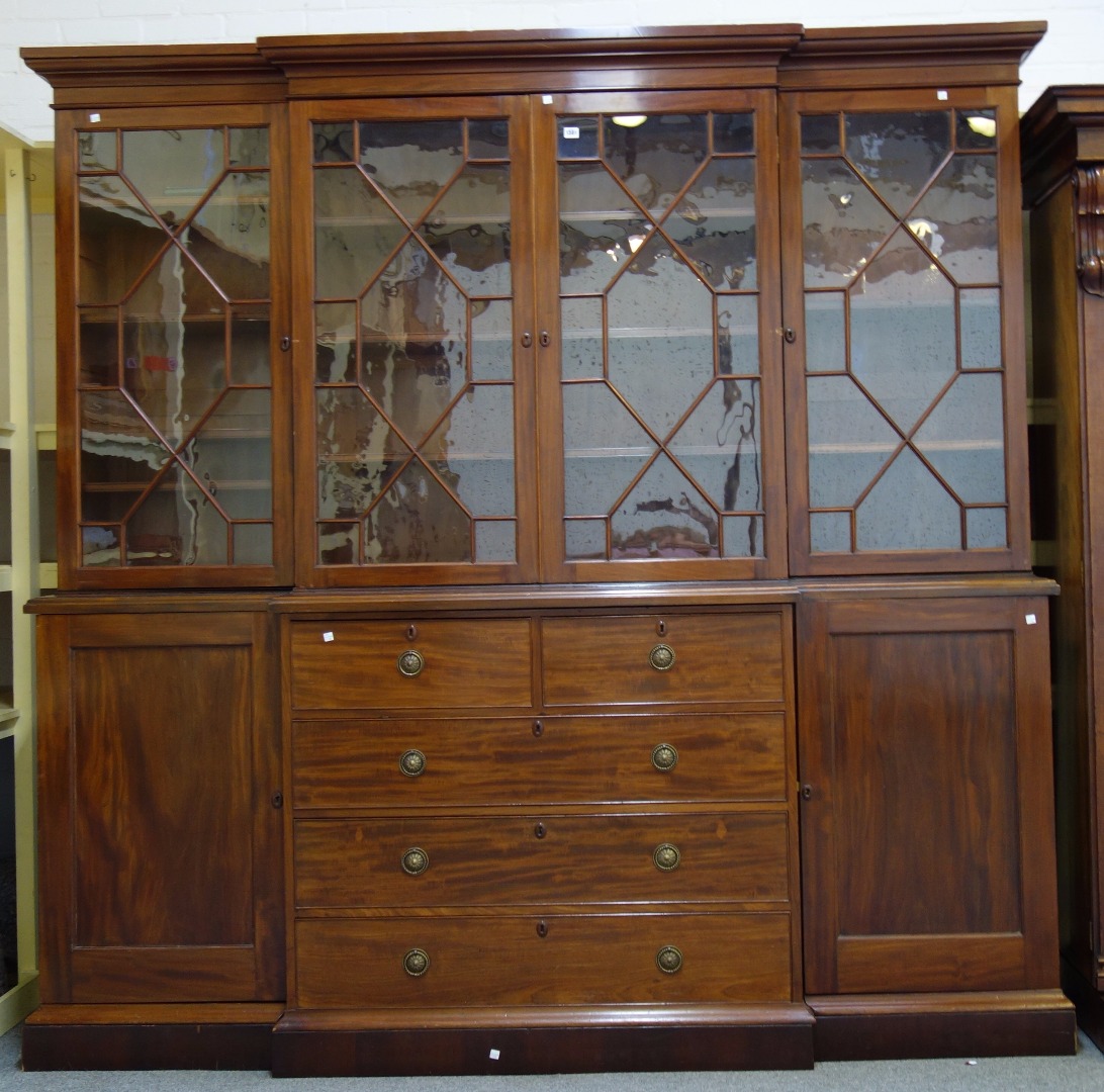 Appraisal: A made-up George III style mahogany breakfront bookcase the four