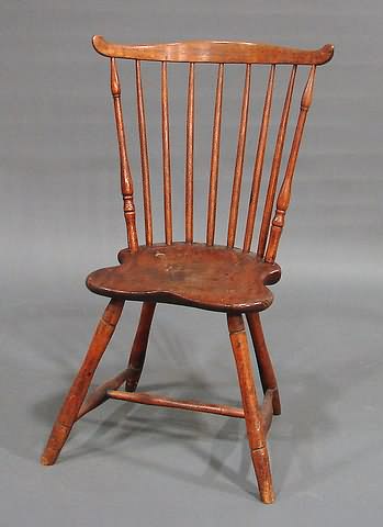 Appraisal: Deeply bowed crest rail spindles saddle seat splayed bamboo-turned legs