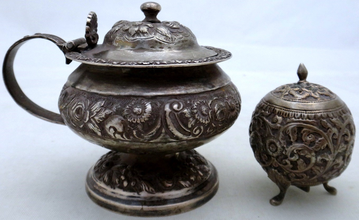 Appraisal: A silver mustard pot of circular form with embossed decoration