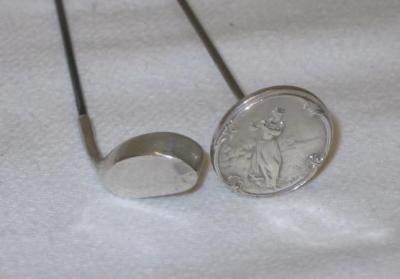 Appraisal: TWO SILVER GOLF HAT PINS one modelled as a putter