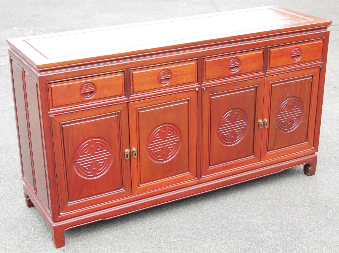 Appraisal: A modern polished hardwood oriental design sideboard the rectangular top