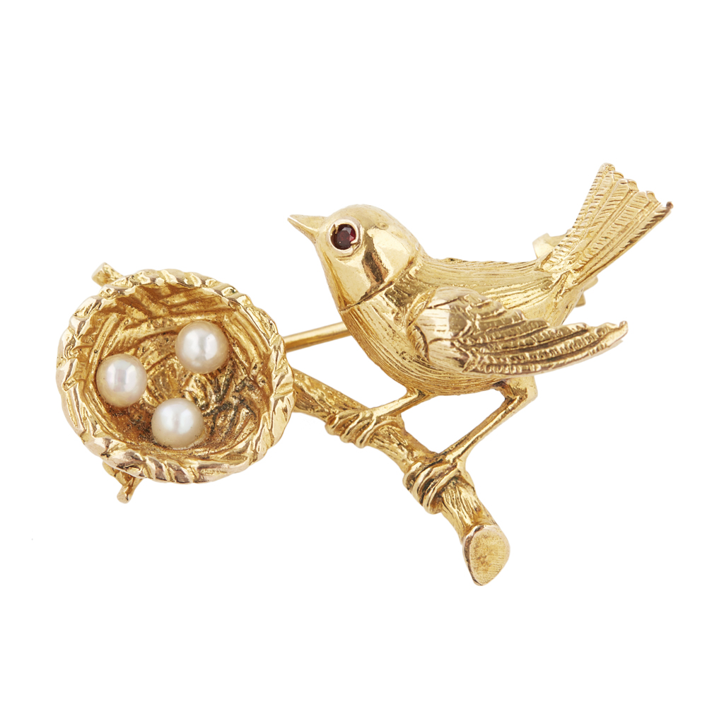 Appraisal: A ruby and pearl set bird brooch modelled as a