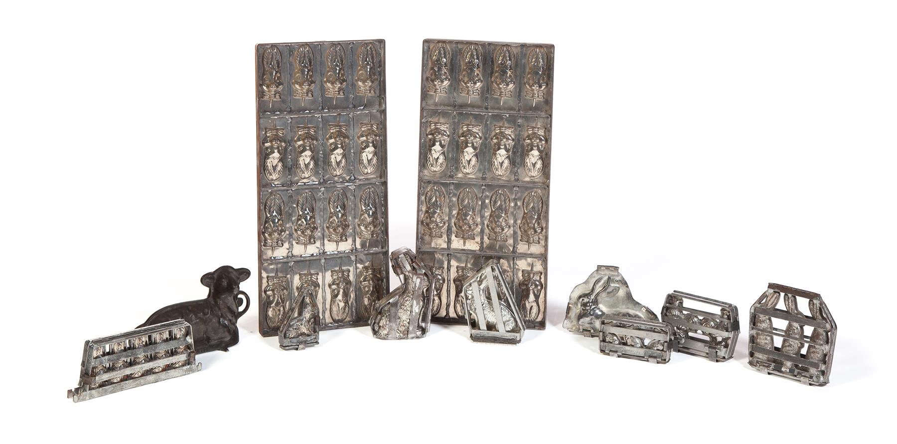 Appraisal: ELEVEN CHOCOLATE MOLDS American th century Group includes a five-rabbit