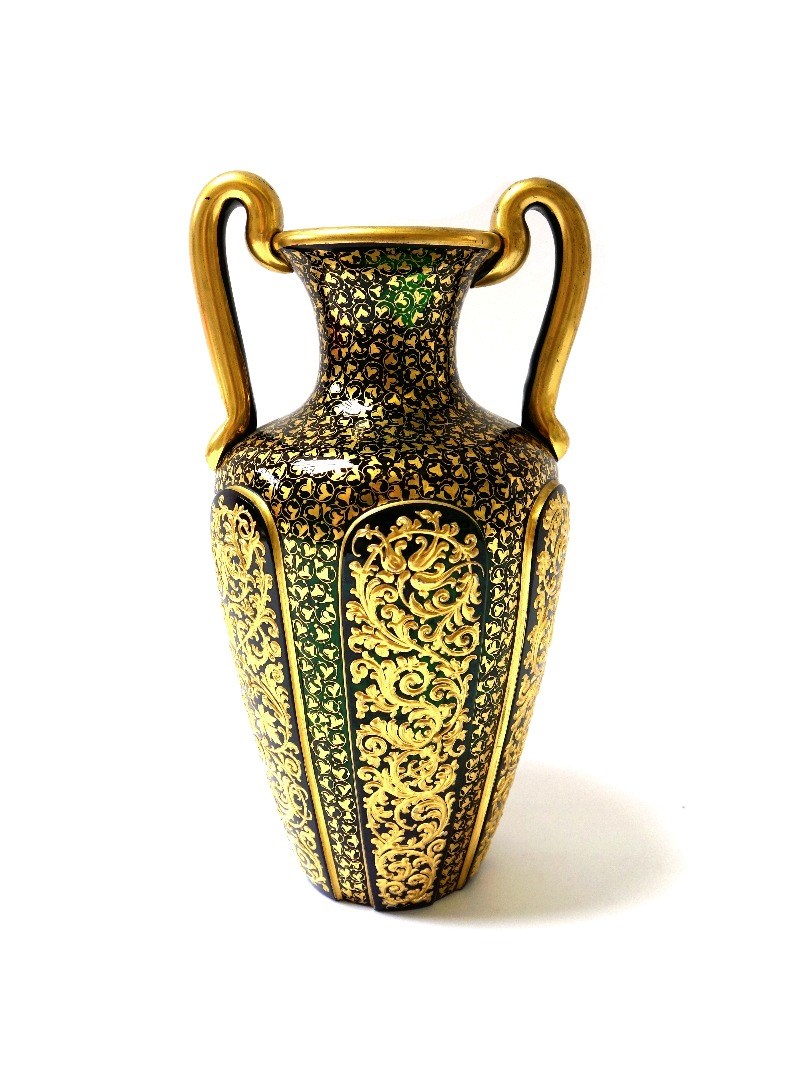 Appraisal: A green and gilt two handled glass vase possibly Lobmeyer