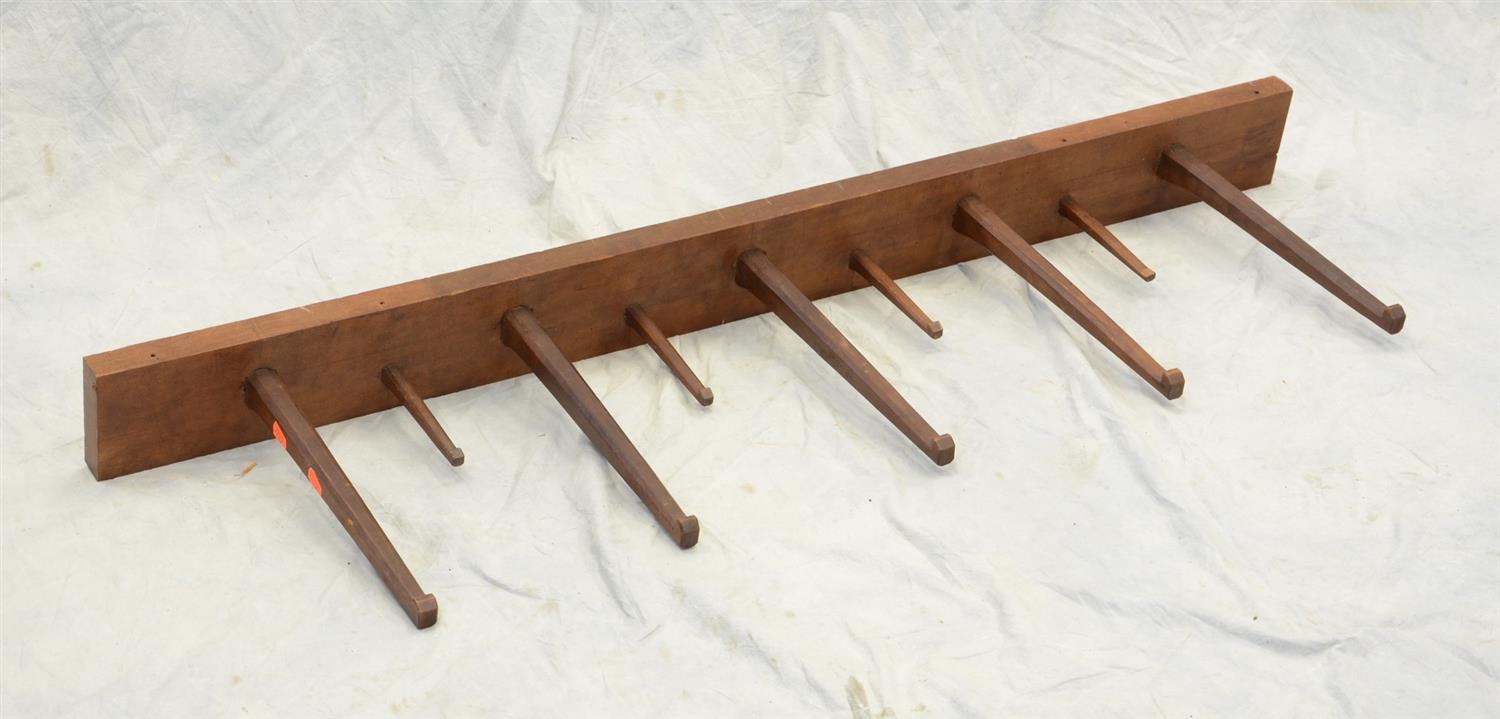 Appraisal: hook cherry peg rack consisting of long and short pegs