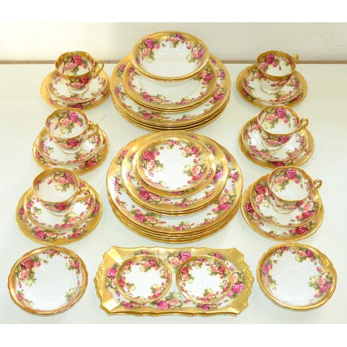 Appraisal: A Royal Chelsea bona china Golden Rose pattern dinner service