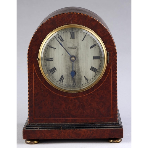 Appraisal: An amboyna mantel timepiece c with barber ole stringing the