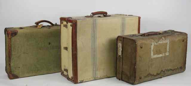 Appraisal: A canvas and leather cabin trunk and two other cases