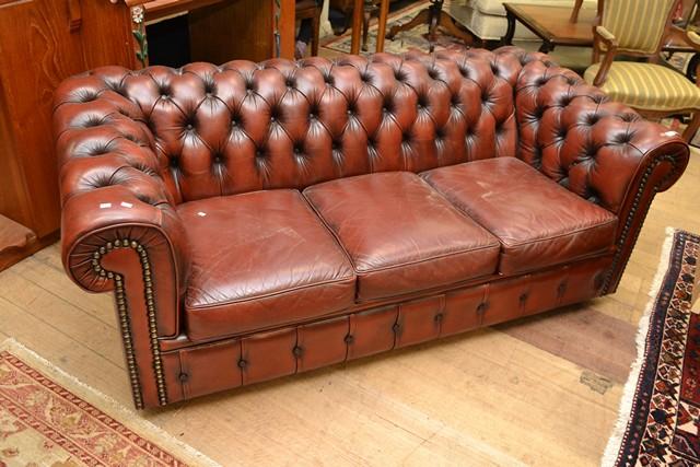 Appraisal: CHESTERFIELD STYLE BUTTONED LEATHER THREE SEATER SOFA CHESTERFIELD STYLE BUTTONED