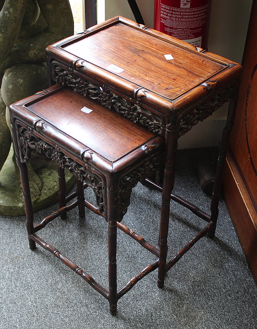 Appraisal: A NEST OF TWO CHINESE HARDWOOD OCCASIONAL TABLES late th