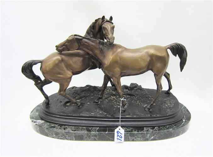 Appraisal: SOLID BRONZE SCULPTURE depicting two horses standing getting acquainted Both