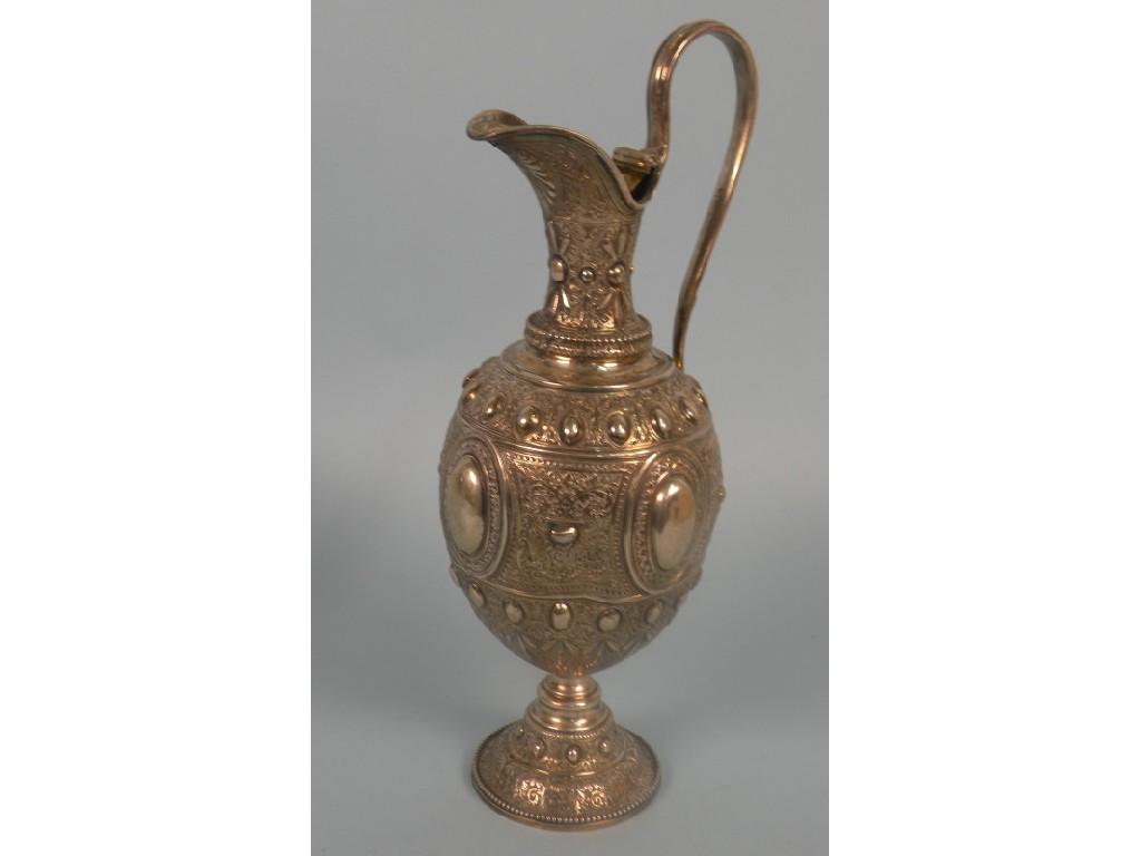 Appraisal: A Victorian silver claret jug embossed and engraved with panels