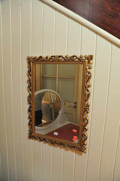 Appraisal: A GILDED WALL MIRROR