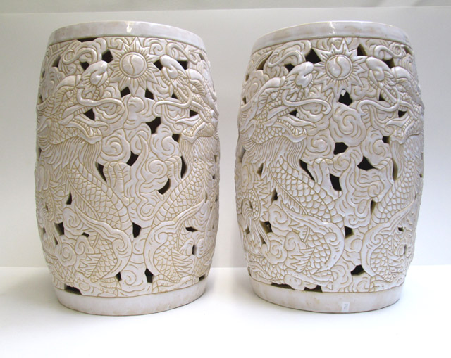 Appraisal: PAIR OF CHINESE DRAGON GARDEN STOOLS having reticulated bodies with