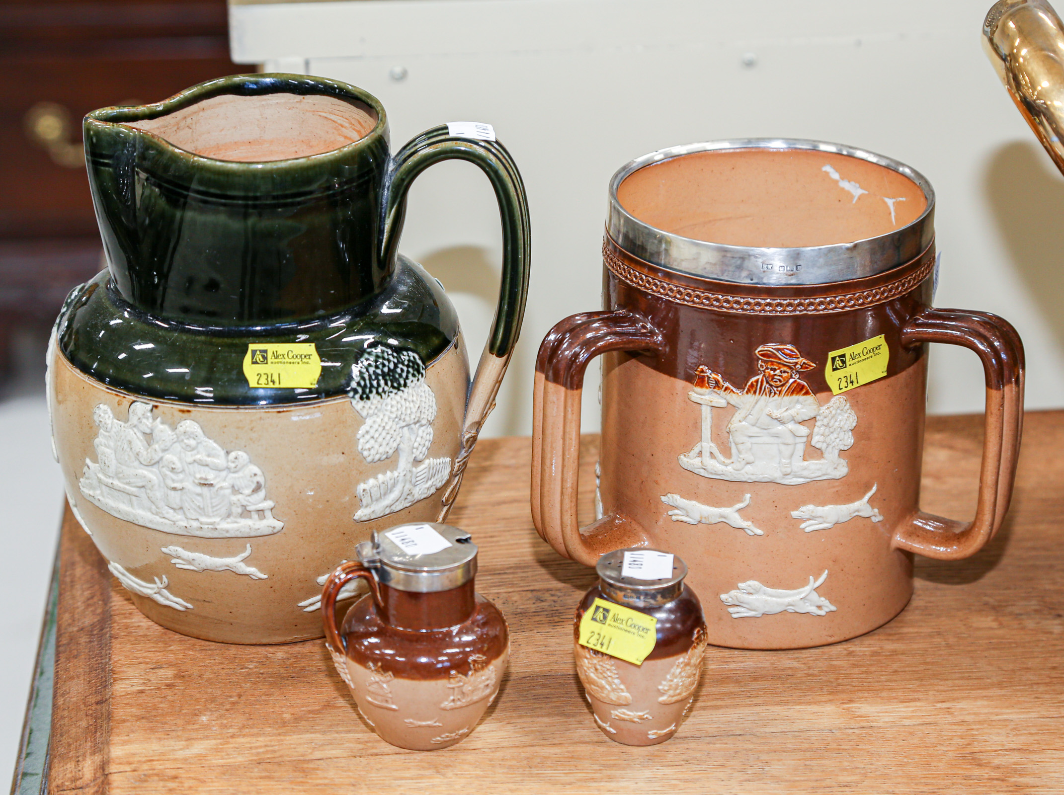 Appraisal: FOUR DOULTON STONEWARE TABLE ARTICLES Including a pitcher with green