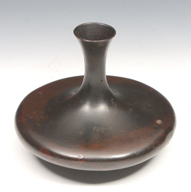 Appraisal: AN ORIENTAL BRONZE OBLATE VASE on a circular base with