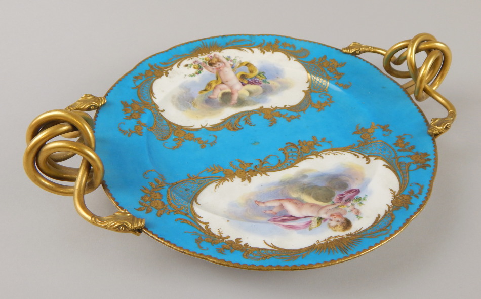 Appraisal: A late thC Sevres style two handled centrepiece decorated with