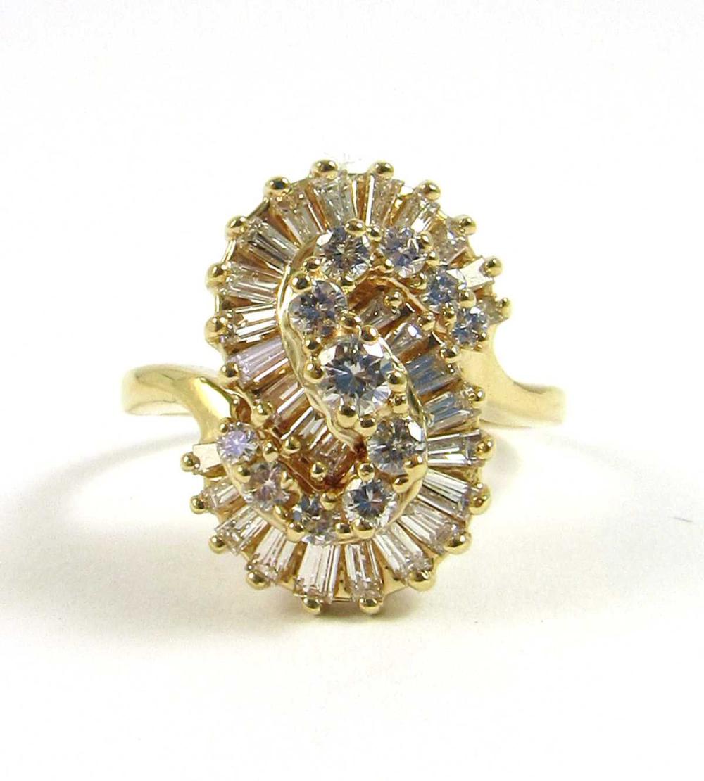 Appraisal: DIAMOND AND FOURTEEN KARAT GOLD RING with an S-shaped cluster