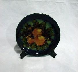 Appraisal: A Moorcroft blue ground Finches and Pomegranate plate c impressed