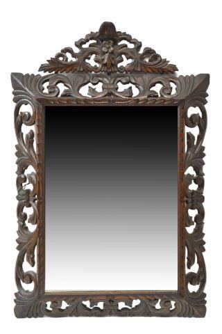 Appraisal: Italian oak hanging wall mirror early th c having carved