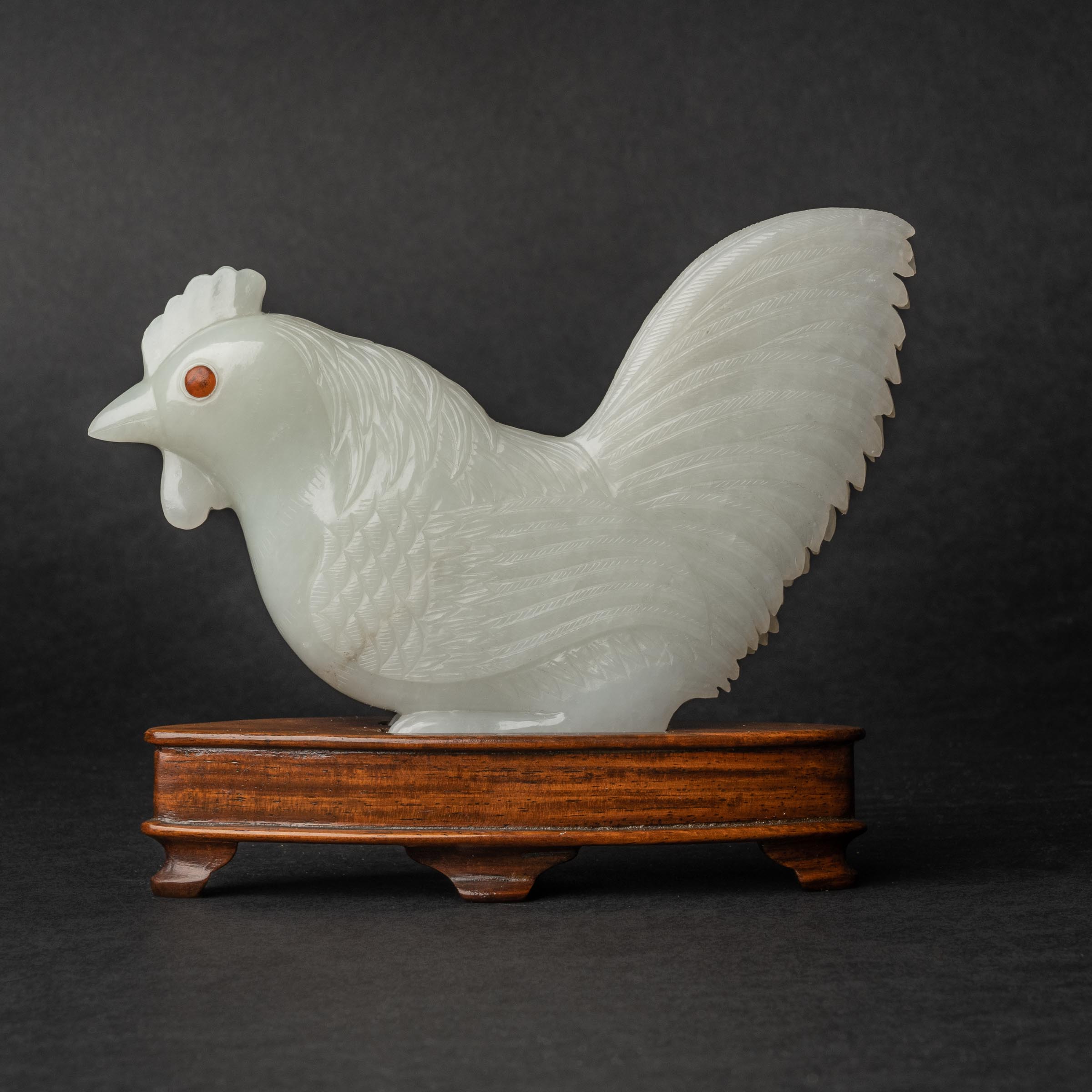 Appraisal: A White Jade Carving of Rooster Inlaid With Amber Eyes