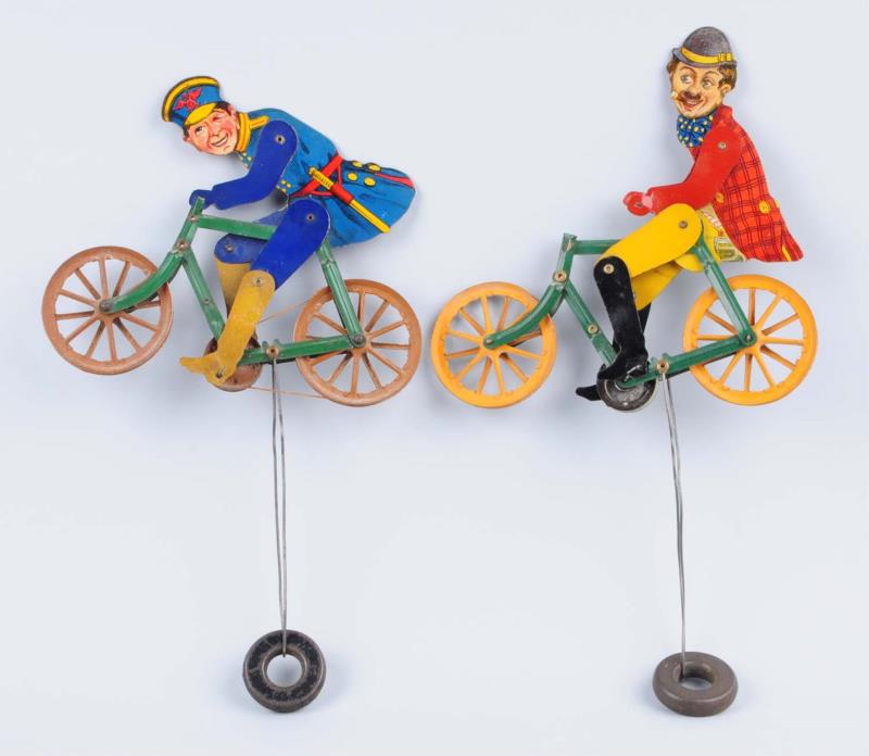 Appraisal: Lot Of American Made Character Bicycle Toys These tin litho