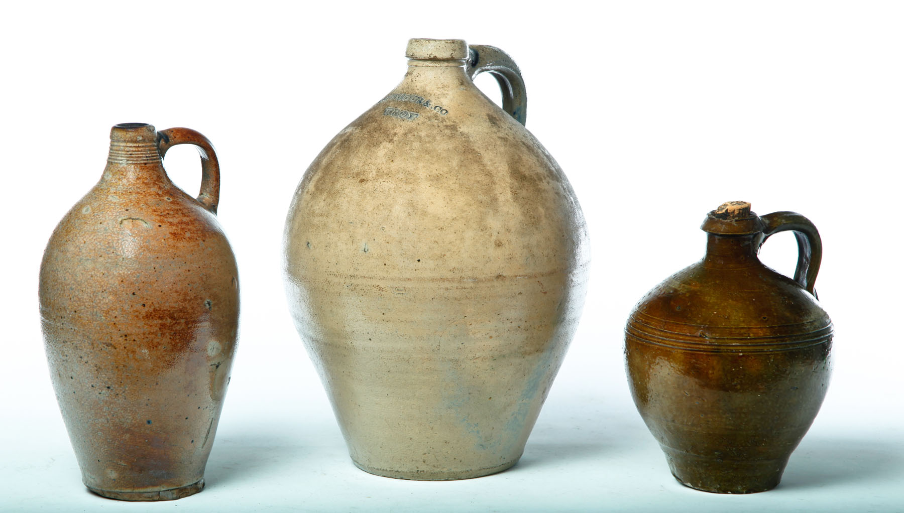 Appraisal: THREE JUGS American st half- th century Ovoid with applied