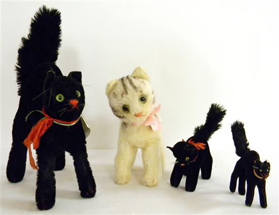 Appraisal: Four Steiff cats '' h mohair black tom cat missing