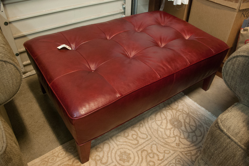 Appraisal: A RECTANGULAR RED LEATHER OTTOMAN unknown maker recent production having