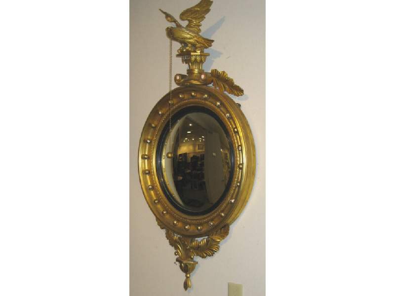 Appraisal: FEDERAL STYLE GILTWOOD CONVEX WALL MIRROR Fully carved wooden figure