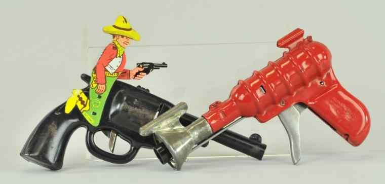 Appraisal: LOT OF TWO TOY GUNS Both pressed steel with clicking