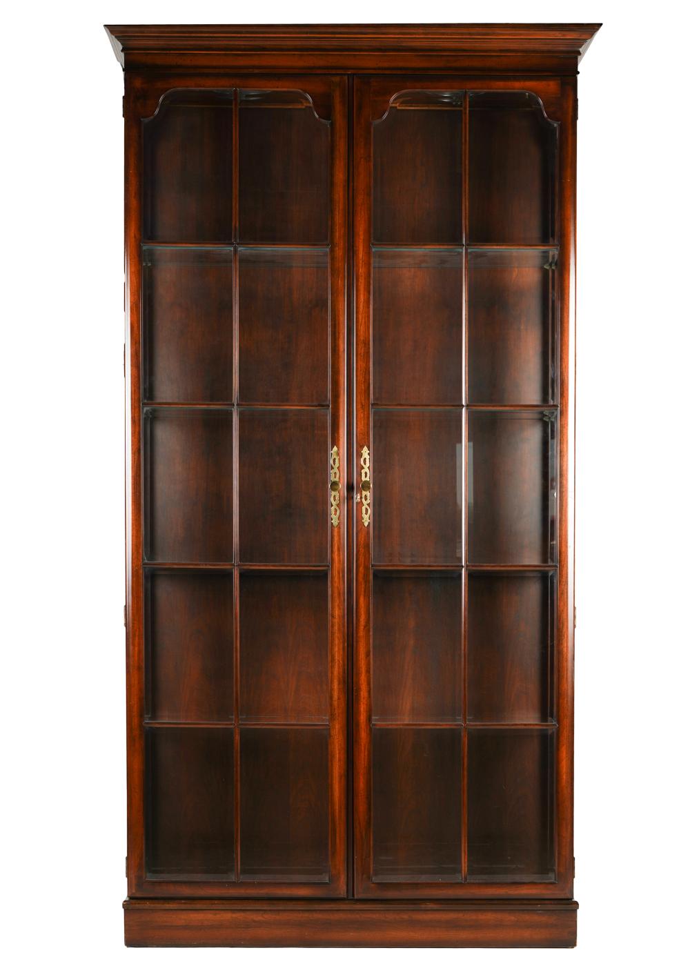 Appraisal: MAHOGANY DISPLAY CABINETthe hinged doors with beveled glass panes opening