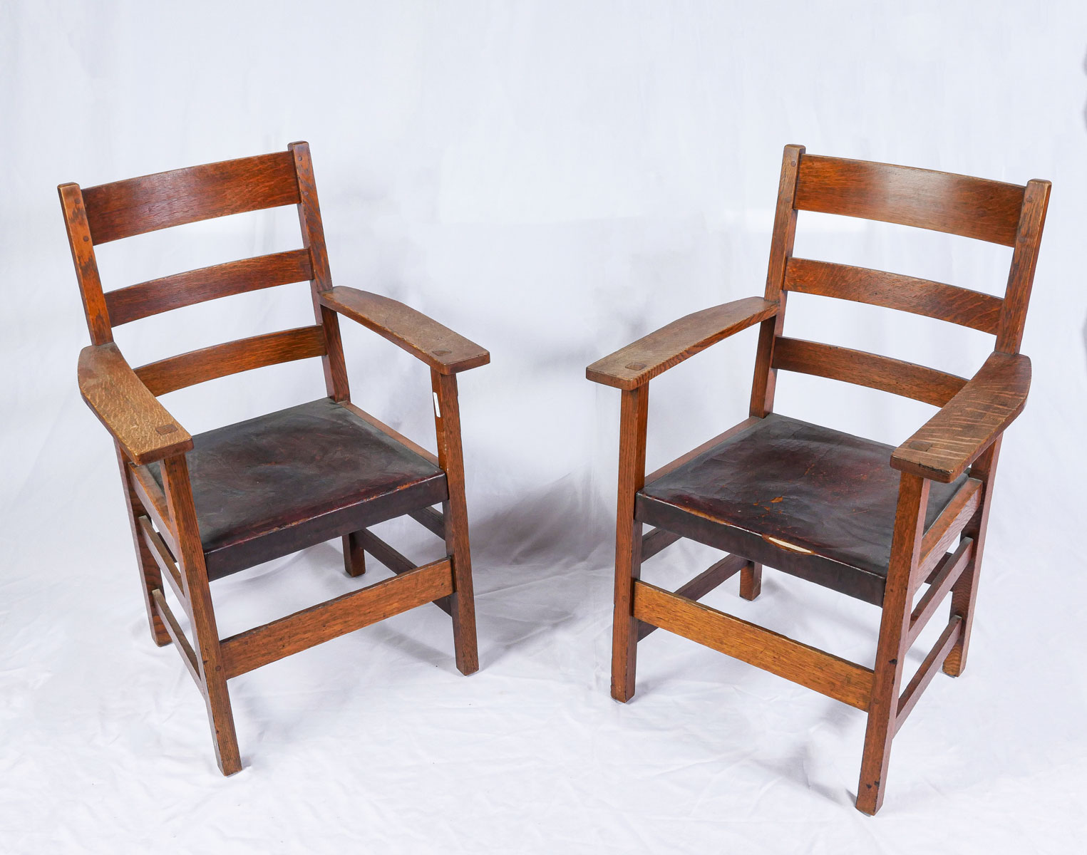 Appraisal: PAIR OF L JG STICKLEY OAK ARMCHAIRS Pair of slat