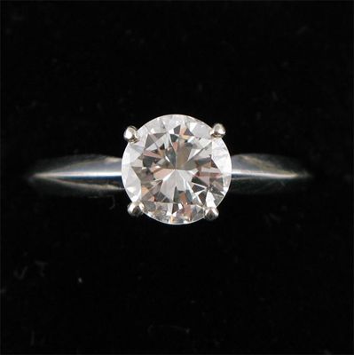 Appraisal: A diamond solitaire ring The circular cut diamond is set