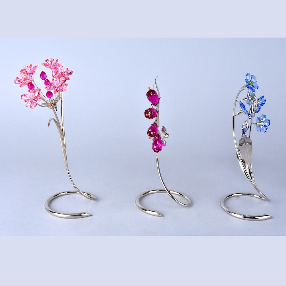 Appraisal: Three Swarovski Flowers Three Swarovski crystal flowers on chrome stem