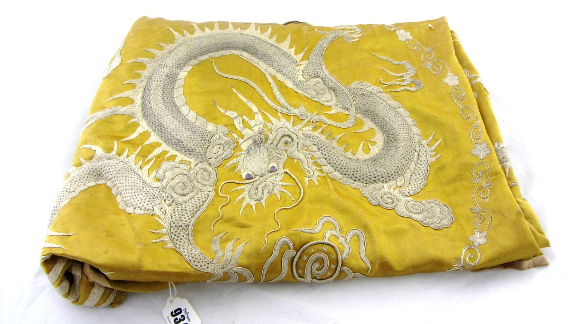 Appraisal: A Vietnamese gold ground embroidered silk panel worked with one