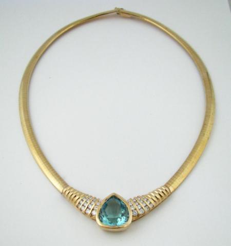 Appraisal: K Yellow gold omega necklace with pear shaped aquamarine approximately