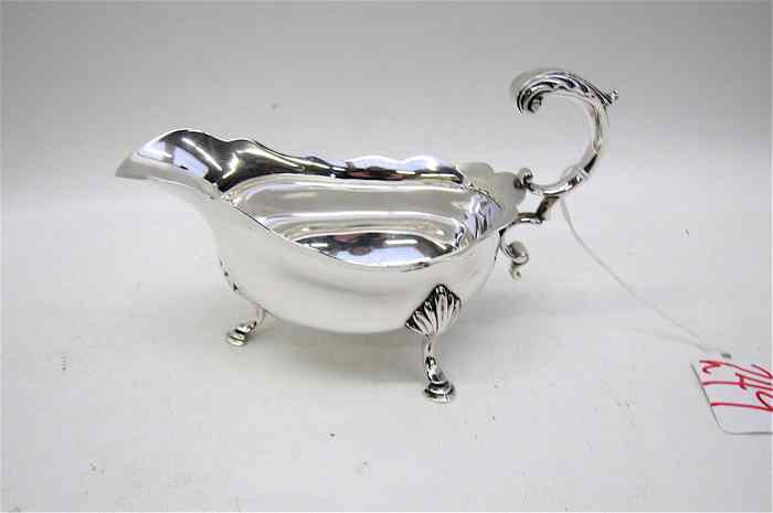 Appraisal: LONDON STERLING SILVER TRI-FOOTED SAUCE BOAT hallmarked British sterling year