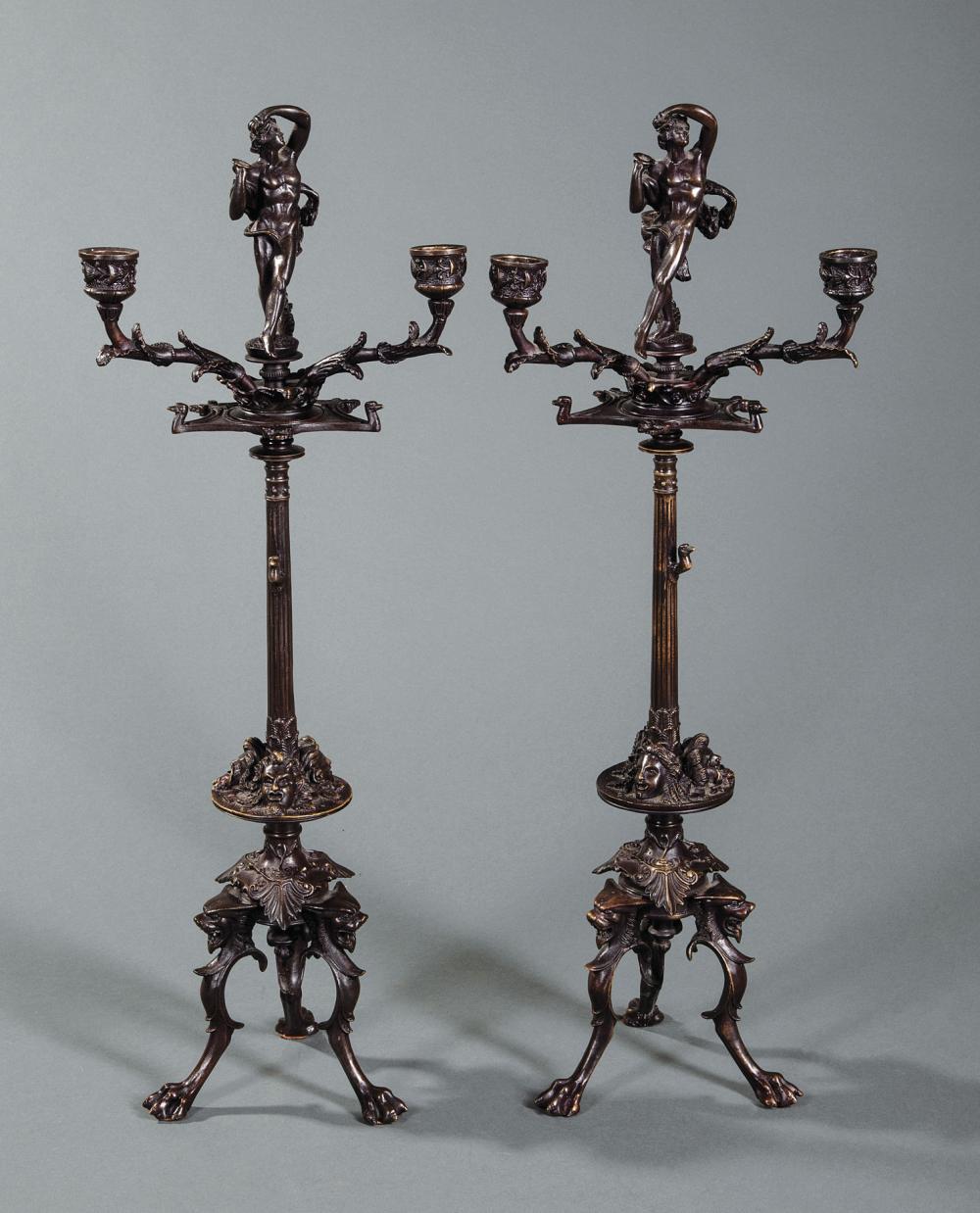 Appraisal: Pair of Continental Patinated Bronze Figural Three-Light Candelabra th c