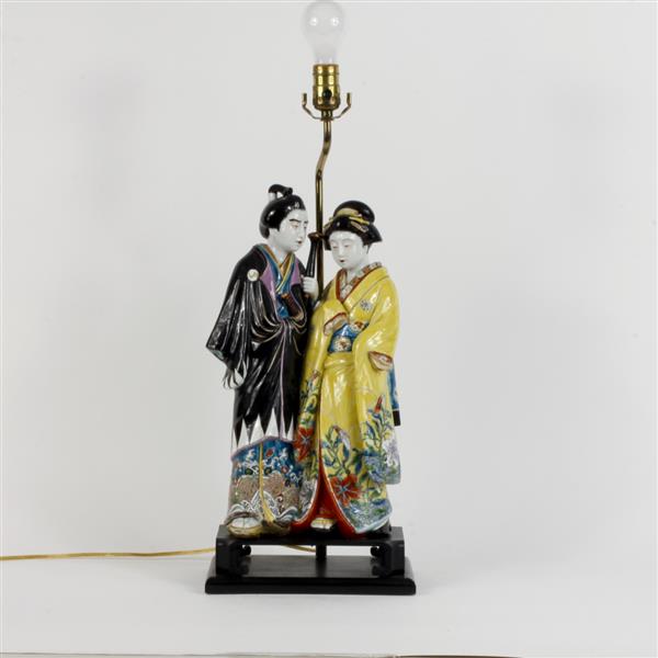 Appraisal: Japanese glazed porcelain male and female figural group mounted as