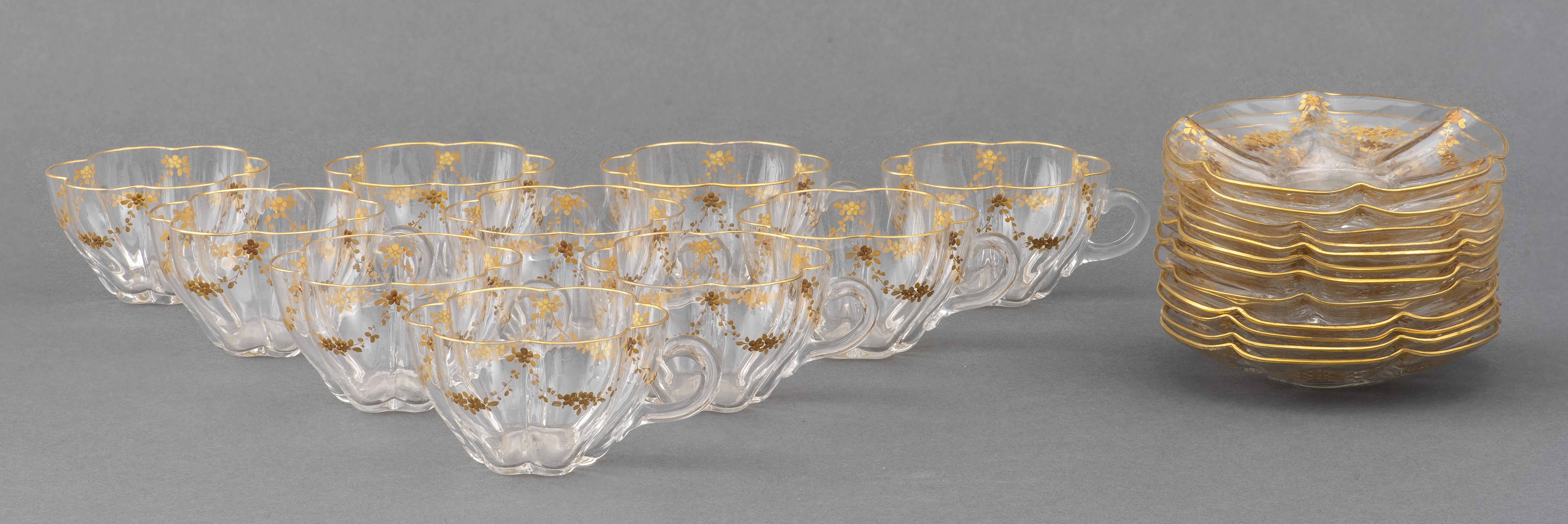 Appraisal: GILT GLASS TEACUPS AND SAUCERS SET OF Set of ten