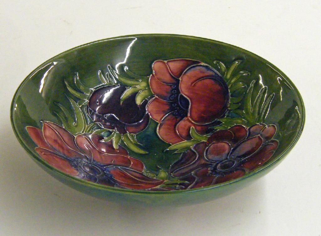 Appraisal: Moorcroft 'Anenome' circular bowl decorated upon a green ground painted