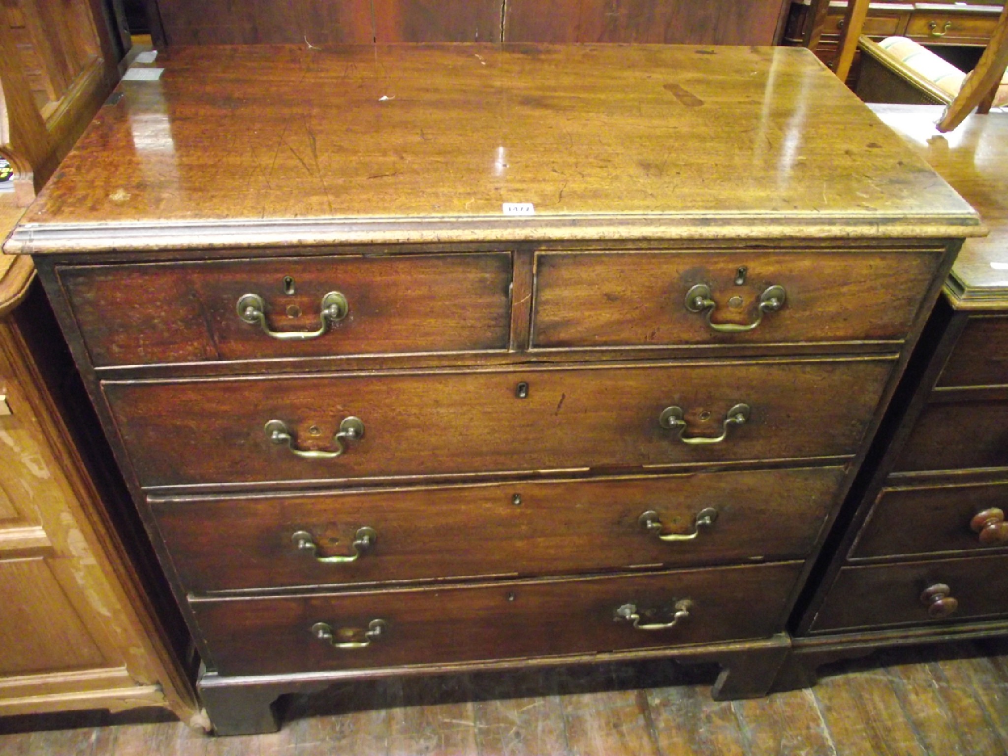 Appraisal: A Georgian mahogany chest of three long and two short