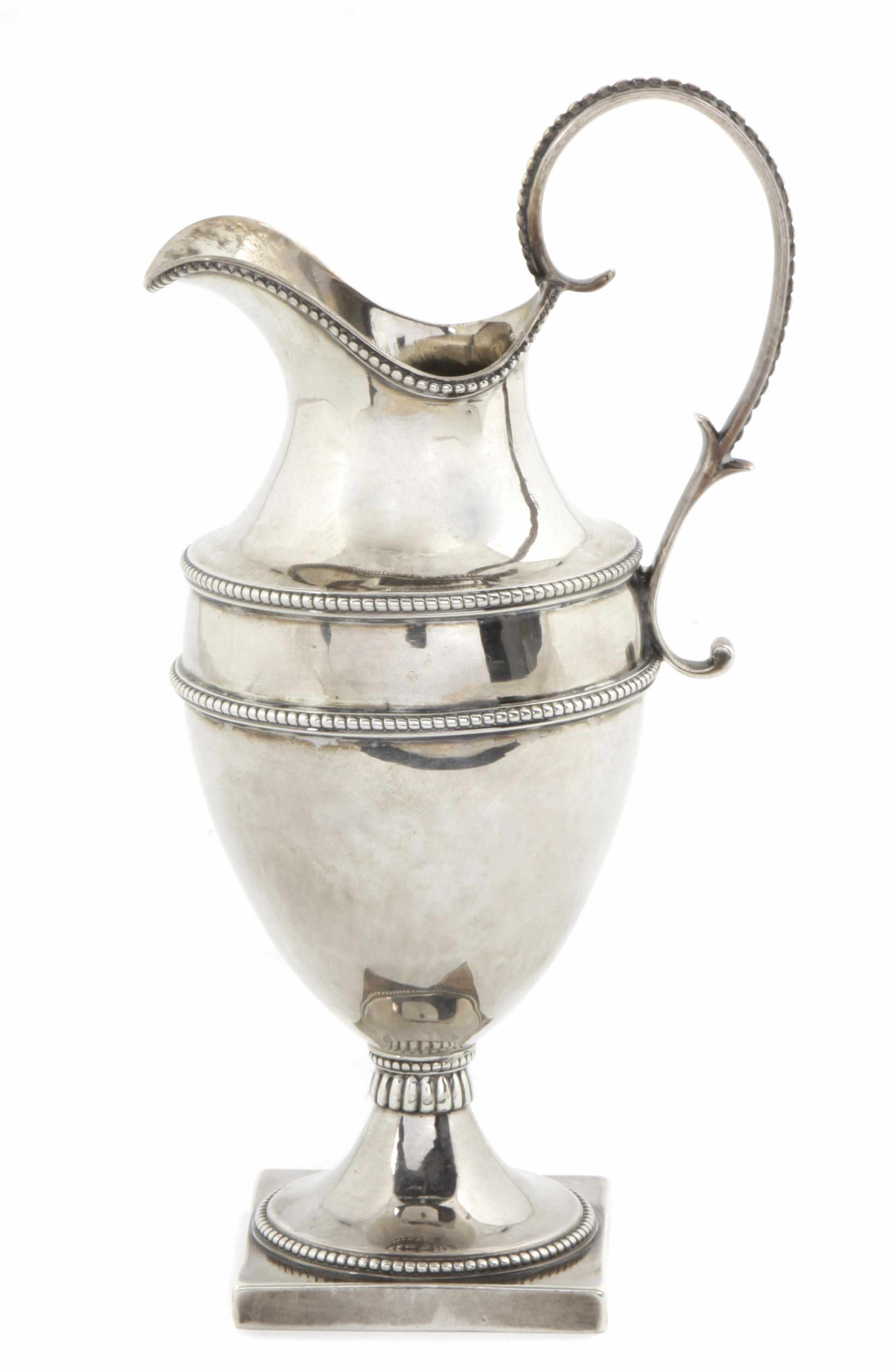 Appraisal: A George III sterling silver pedestal cream jug London Maker's